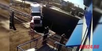 Train destroys trailer truck in Russia