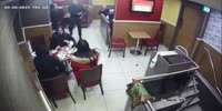 Big dudes beat the shit out of a guy for dropping food on the clothes
