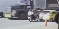 Couple of bikers fall under the trailer truck