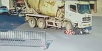 Scooter Couple Fall Under Cement Truck