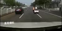 Woman trying to stop her runaway Car