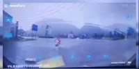 Lightning strikes ground inches away from scooter
