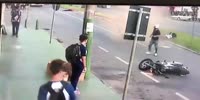 Pedestrian takes down two motorcycles running carelessly from in front of a bus.