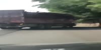 Chinese trooper dies under the truck (R)