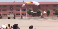 Parachutist crashes during army display