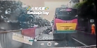 Rider Falls Under Bus