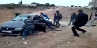 A crowd of villagers kills a couple while having sex inside a car