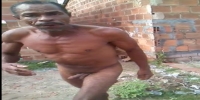 Nude man fights in slums