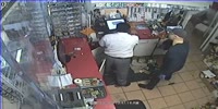 Robber Handcuffs Clerk