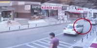 Woman falls on moving car