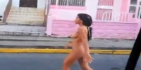 Naked girl in a street (R)
