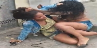 Girls fight on dirty street