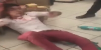 Dude in red pants beaten by store clerks & customers