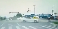 Biker Turned Gymnast at Intersection