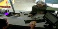 Ticket seller shoots armed robber