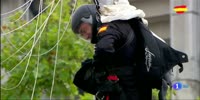 Spain: Parachutist hits light pole during a military parade landing.