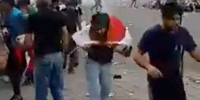 Iraqi Protestor Gets Gas Can in the HEAD