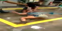 Gas station worker pours water on fighting gals