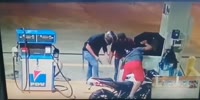 Armed thugs rob gas station worker talking to his son