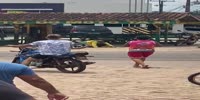 Motorcycle taxi drivers fight in dust