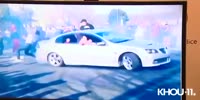 Police safety video of cars and spectators.