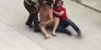 Naked man fights off police refusing to stay at home in Colombia