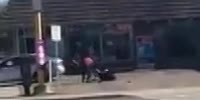 Woman getting beat outside a liquor store with a bat