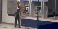 Man destroys ATM with a sledgehammer