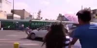 Car slams thru group of protesters