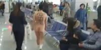 Chinese girl strips naked in the airport