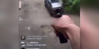 The moron shoots out the window at people and cars
