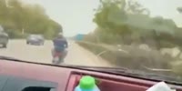 Man on scooter becomes hood ornament (R)