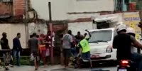 Thief being captured and beaten by people on the street