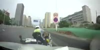 Car Plows into Motorcycle Cop