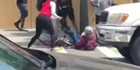 Old man tries to protect woman from being robbed and gets beaten by gang