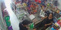 Veracruz woman cries after thugs rob her store