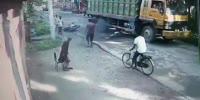Biker Loses Control, Crushed by Truck