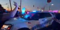 COPS CAR VS PROTESTERS