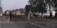 Old footage of a woman walking directly into train