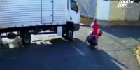 Scooter Rider Gets Run Over By Box Truck