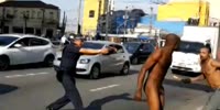 Fight, machete, nudity and shots in Brazilian street (R)