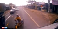 Rider Falls Under Truck In Vietnam