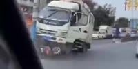 Chinese Rider Gets Crushed By Box Truck