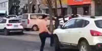 Crazy Chinese Man Attacks Random Cars & Gets Beaten