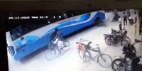 Biker Knocked Under Wheels of a Bus