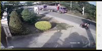 Thai Biker Slides Under The Truck Wheels