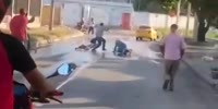 Group Of Angry Men Chase & Stomp Motorcycle Thief In Colombia