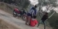 Red Shirt Beaten With Long Sticks In Front Of His Lady In India