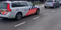 Dutch protesters pelt police car with rocks etc...