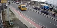 Biker disappears under truck